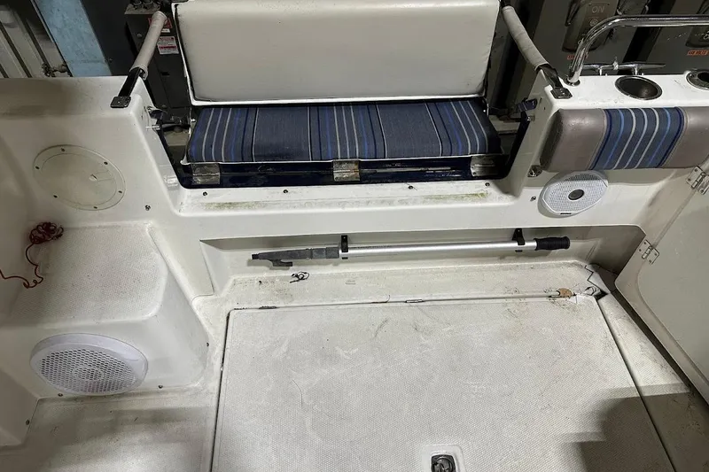 Slide: The Image of 2017 Cutwater C-302 Coupe interior with striped seating and storage compartments. - 22