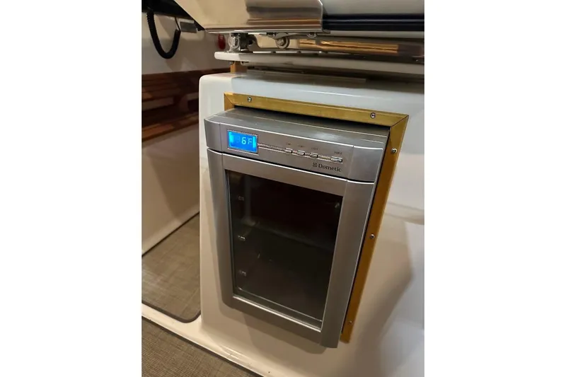 Slide: The Image of Dometic fridge in 2017 Cutwater C-302 Coupe boat interior. - 30