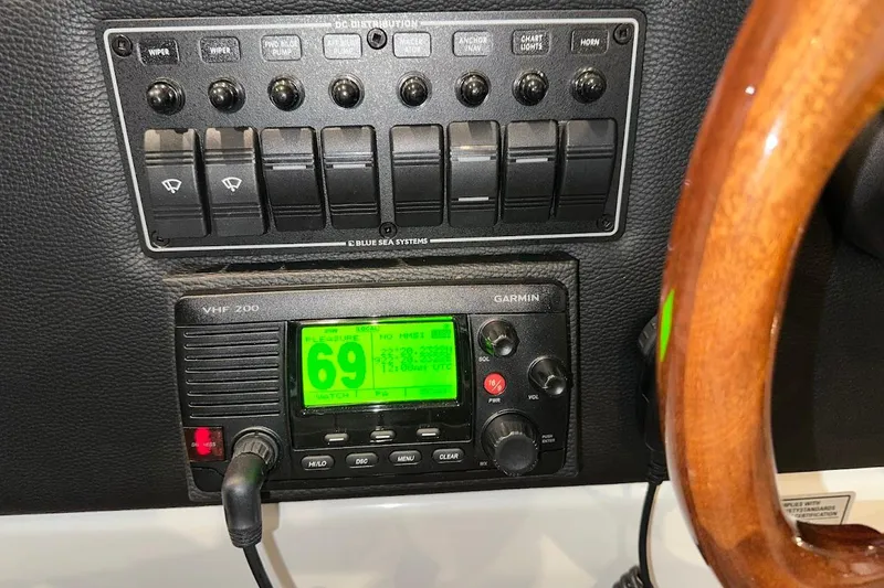 Slide: The Image of Control panel of 2017 Cutwater C-302 Coupe with Garmin VHF 200 radio. - 33