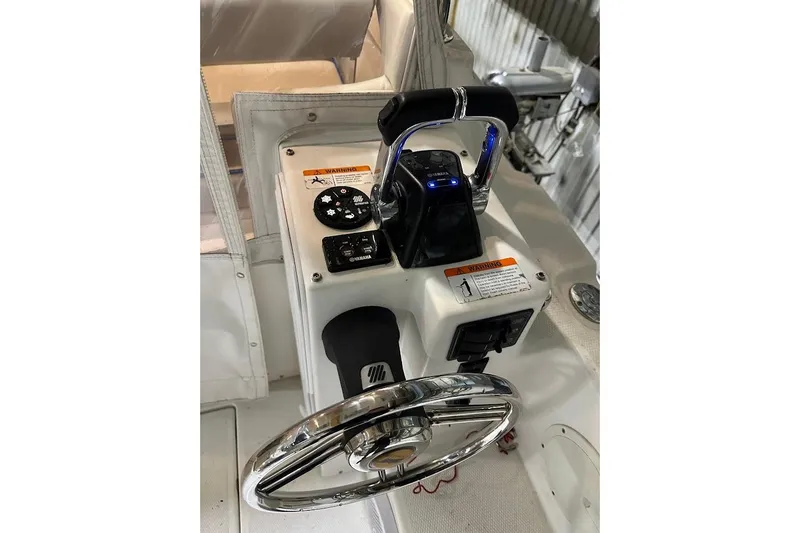 Slide: The Image of 2017 Cutwater C-302 Coupe helm with steering wheel and control panel. - 39