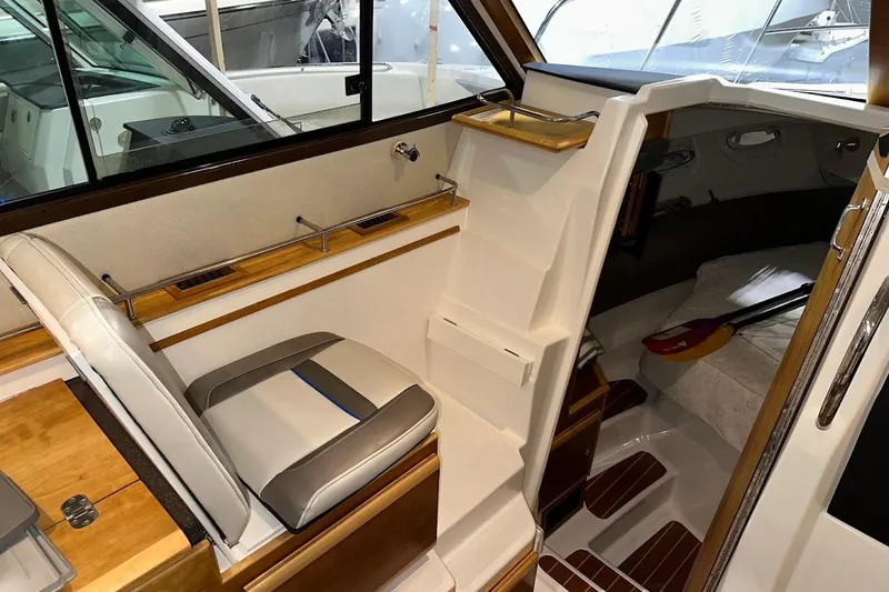 Slide: The Image of Interior of 2017 Cutwater C-302 Coupe boat, featuring seating and cabin entrance. - 40