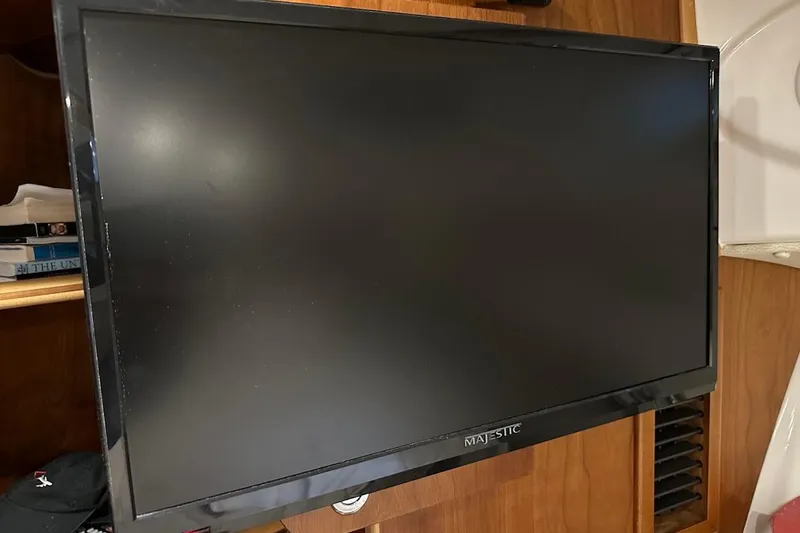 Slide: The Image of Flat-screen TV inside 2017 Cutwater C-302 Coupe boat, mounted on wooden panel. - 46