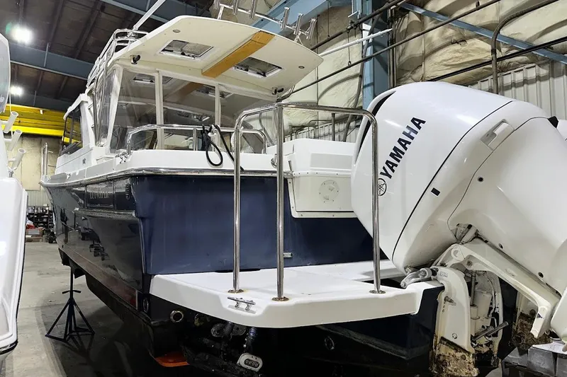 Slide: The Image of 2017 Cutwater C-302 Coupe boat with Yamaha outboard engine in a warehouse. - 7