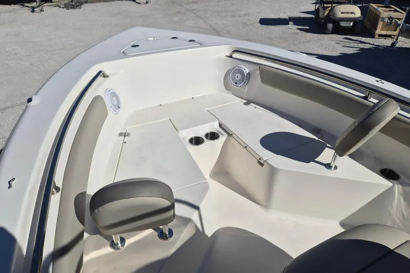 Slide: The Image of 2022 Key West 203 FS boat interior with seating and speakers. - 10