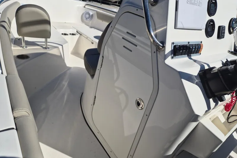 Slide: The Image of 2022 Key West 203 FS boat interior with seating and control panel. - 13