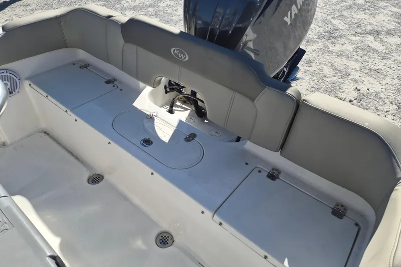 Slide: The Image of 2022 Key West 203 FS boat interior with seating and storage compartments. - 4