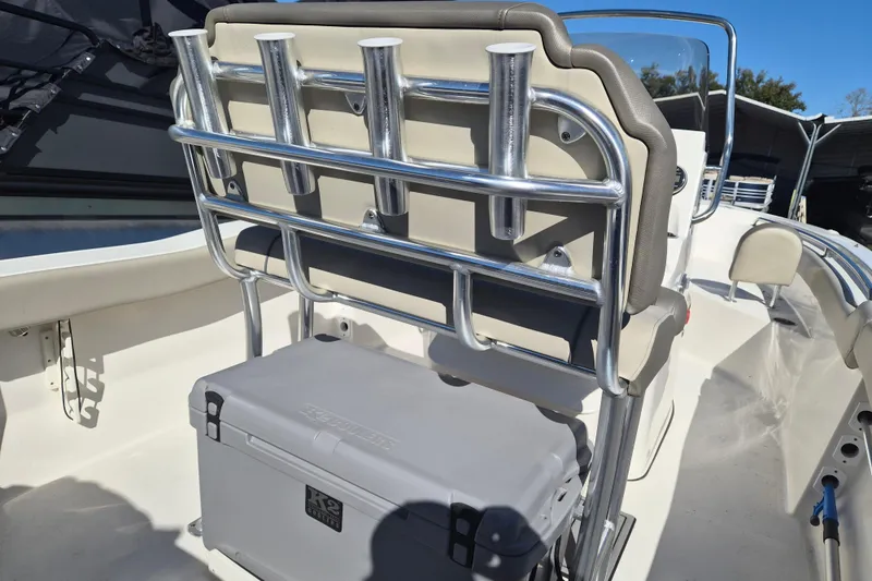 Slide: The Image of 2022 Key West 203 FS boat interior with rod holders and cooler. - 7