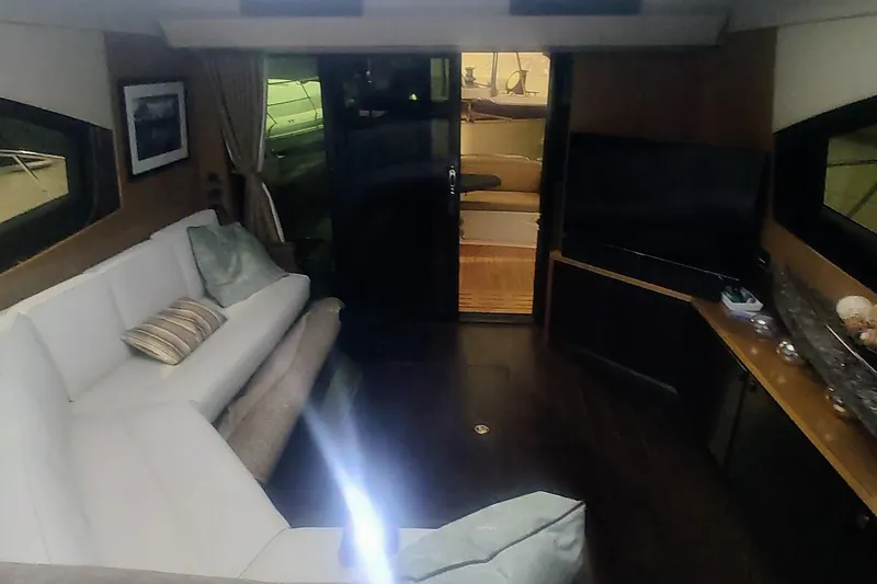 Slide: The Image of Staircase inside 2016 Sea Ray L590 yacht, leading to lower cabin area. - 17