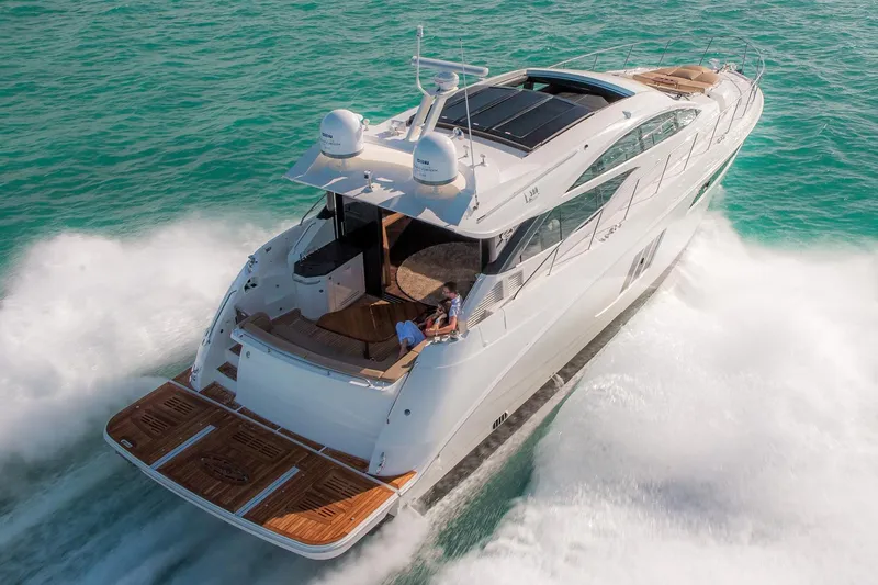 Slide: The Image of Manufacturer Provided Image: 2016 Sea Ray L590 yacht cruising on open water. - 2