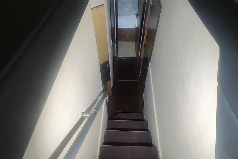 Slide: The Image of Interior view of 2016 Sea Ray L590 yacht cabin with modern furnishings. - 20