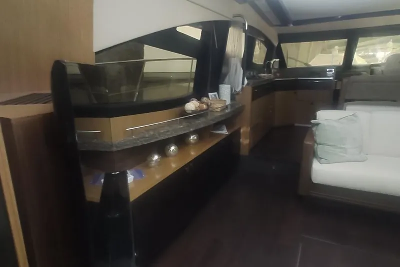 Slide: The Image of Luxurious interior of 2016 Sea Ray L590 yacht with modern wood finishes and ambient lighting. - 24