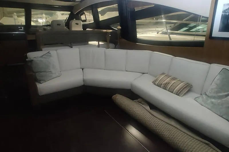 Slide: The Image of Interior cabin of 2016 Sea Ray L590 yacht with cozy bedding and window blinds. - 25