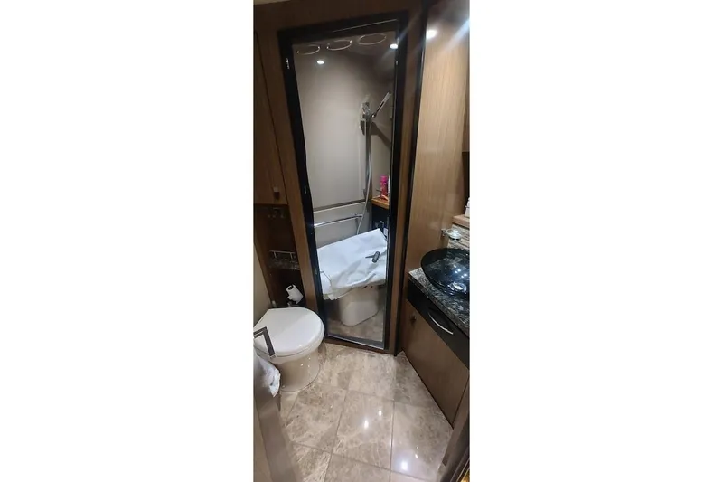 Slide: The Image of Luxurious bathroom in 2016 Sea Ray L590 yacht with modern fixtures and elegant design. - 29