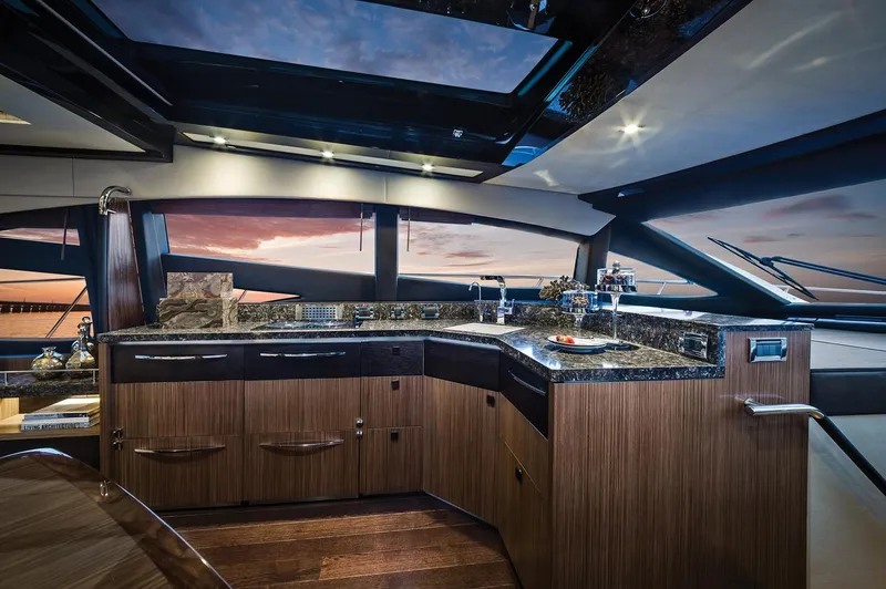 Slide: The Image of 2016 Sea Ray L590 yacht on a travel lift at a marina. - 3