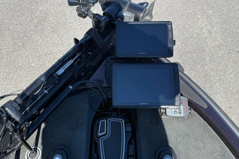 Slide: The Image of 2023 Skeeter ZX200 boat dashboard with dual Garmin displays and foot pedal controls. - 10