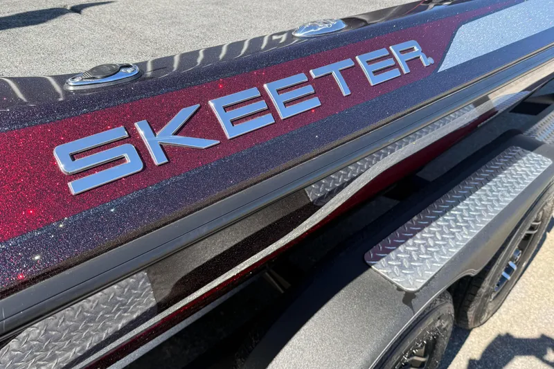 Slide: The Image of 2023 Skeeter ZX200 boat with metallic finish and logo detail. - 3