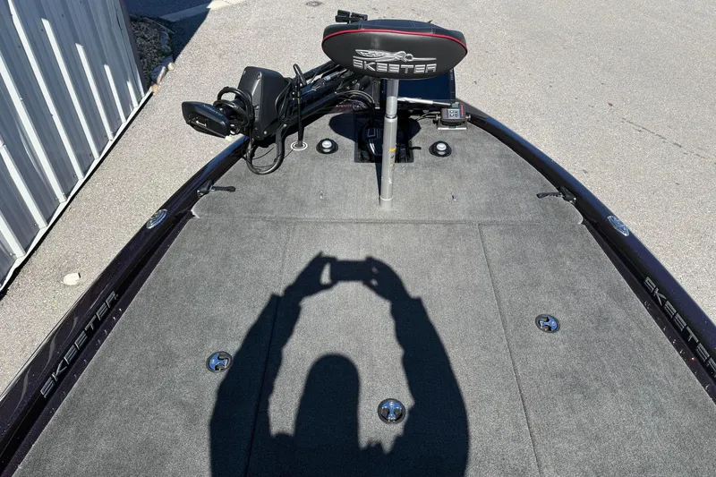 Slide: The Image of 2023 Skeeter ZX200 boat deck with shadow, featuring fishing seat and equipment. - 6