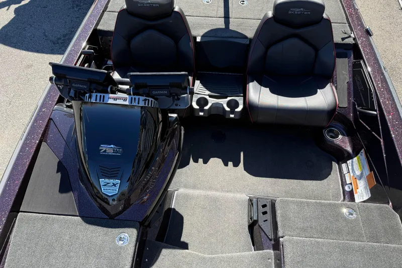 Slide: The Image of 2023 Skeeter ZX200 boat interior with dual Garmin displays and comfortable seating. - 7