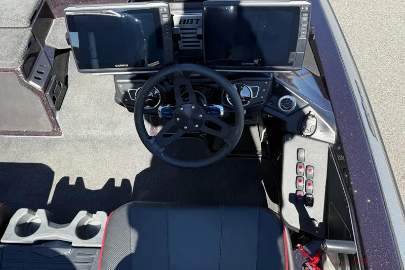 Slide: The Image of 2023 Skeeter ZX200 boat cockpit with dual Garmin displays and steering wheel. - 9