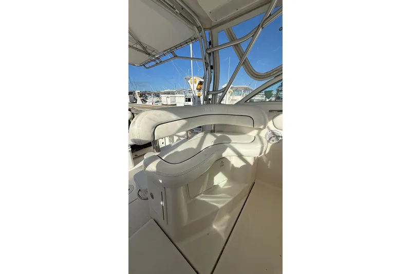 Slide: The Image of 2007 Wellcraft 290 Coastal boat interior with white seating and metal framework. - 6
