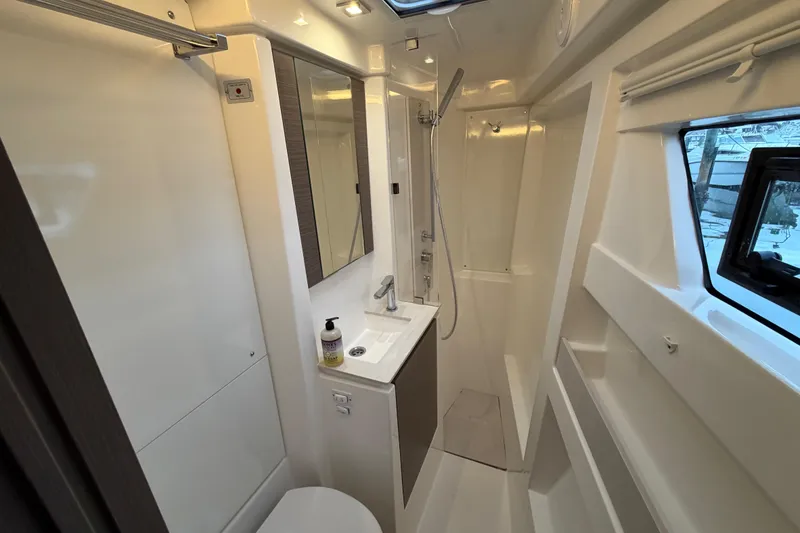 Slide: The Image of Luxurious 2025 Leopard 46 yacht interior with modern seating and wooden table. - 10