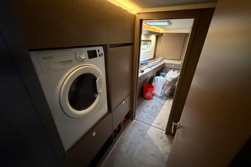 Slide: The Image of Luxurious Leopard 46 yacht interior with sleek seating and wooden table, 2025 model. - 11