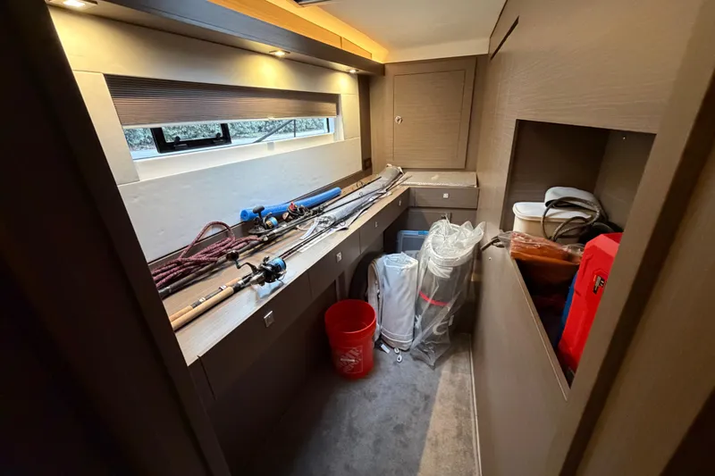 Slide: The Image of Luxurious Leopard 46 yacht interior, featuring a sleek wooden table and comfortable seating, 2025 model. - 12