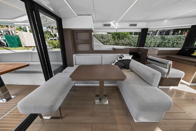 Slide: The Image of Modern interior of 2025 Leopard 46 yacht with sleek seating and wooden table. - 18