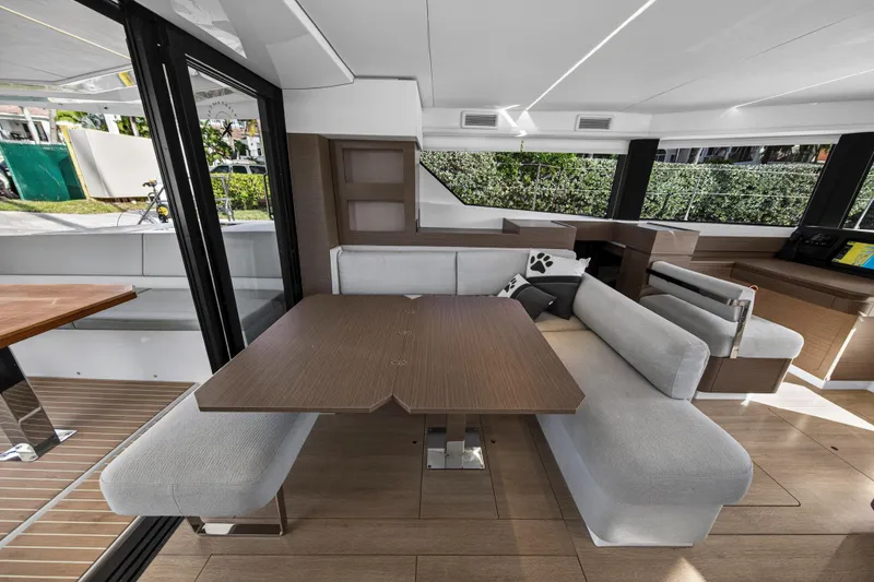 Slide: The Image of Modern interior of 2025 Leopard 46 yacht with sleek dining area and plush seating. - 19