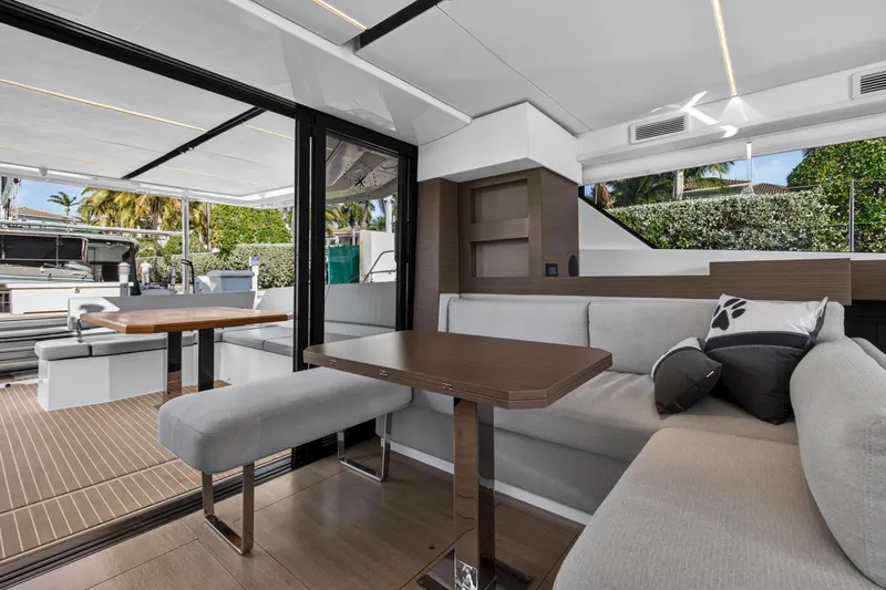 Slide: The Image of Luxurious interior of 2025 Leopard 46 yacht with modern seating and dining area. - 21
