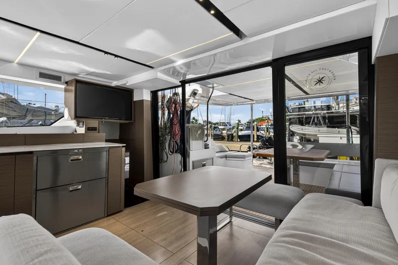 Slide: The Image of Luxurious interior of 2025 Leopard 46 yacht with modern furnishings and marina view. - 23