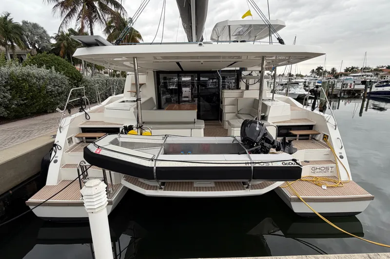 Slide: The Image of Aerial view of 2025 Leopard 46 catamaran docked, featuring solar panels and sleek design. - 3