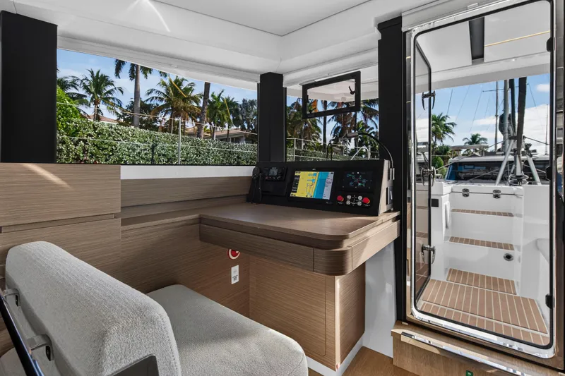 Slide: The Image of Interior of 2025 Leopard 46 yacht with modern navigation controls and tropical view. - 34