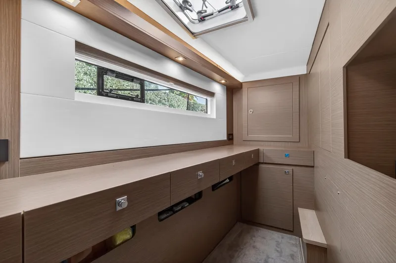 Slide: The Image of Modern interior of 2025 Leopard 46 yacht with sleek wood finishes and ample storage. - 43
