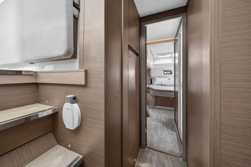 Slide: The Image of 2025 Leopard 46 yacht interior, featuring a modern cabin with sleek wood finishes. - 45