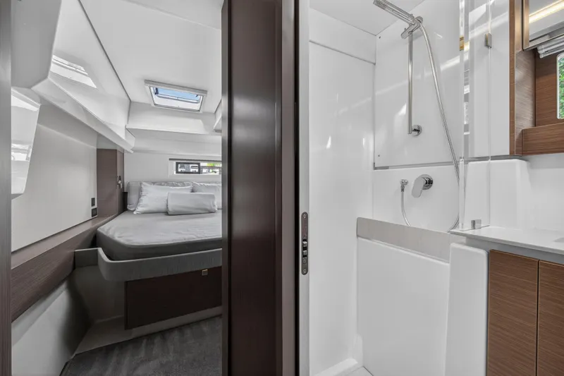 Slide: The Image of Luxurious interior of 2025 Leopard 46 yacht featuring bedroom and modern bathroom. - 46