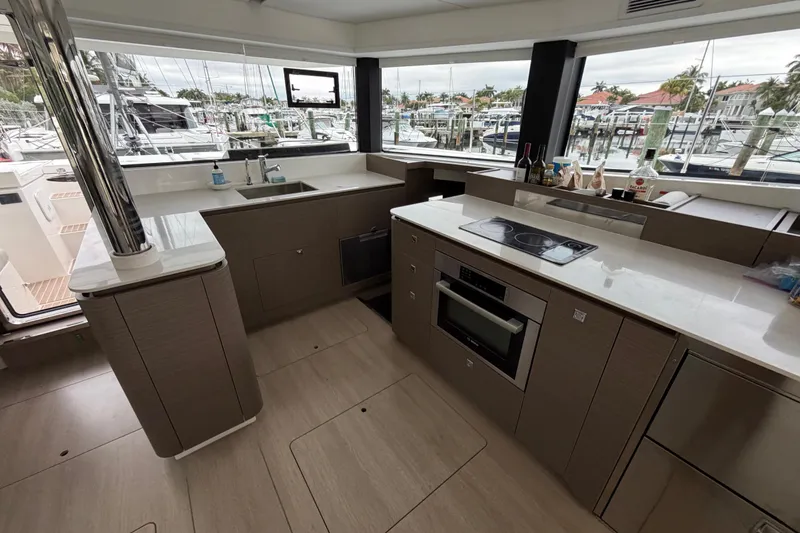 Slide: The Image of Aerial view of 2025 Leopard 46 catamaran docked, featuring solar panels and spacious deck. - 5