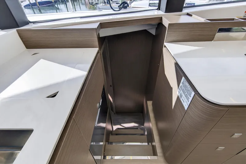 Slide: The Image of Modern interior of 2025 Leopard 46 yacht with sleek wood cabinetry and white countertops. - 52