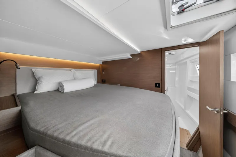 Slide: The Image of Luxurious bedroom interior of 2025 Leopard 46 yacht with modern design and cozy bedding. - 53