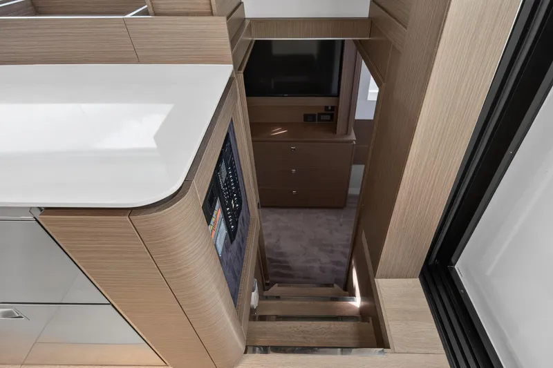 Slide: The Image of Interior of 2025 Leopard 46 yacht, featuring modern wood cabinetry and sleek design. - 57