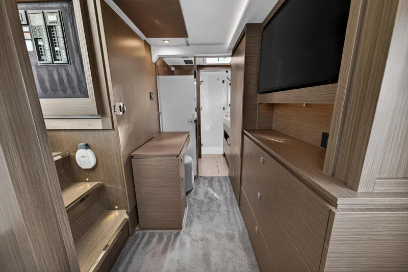 Slide: The Image of Luxurious interior of 2025 Leopard 46 yacht featuring modern wood finishes and sleek design. - 61