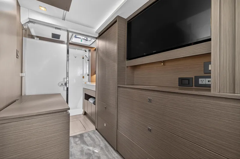Slide: The Image of Luxurious interior of 2025 Leopard 46 yacht featuring modern cabinetry and a flat-screen TV. - 63