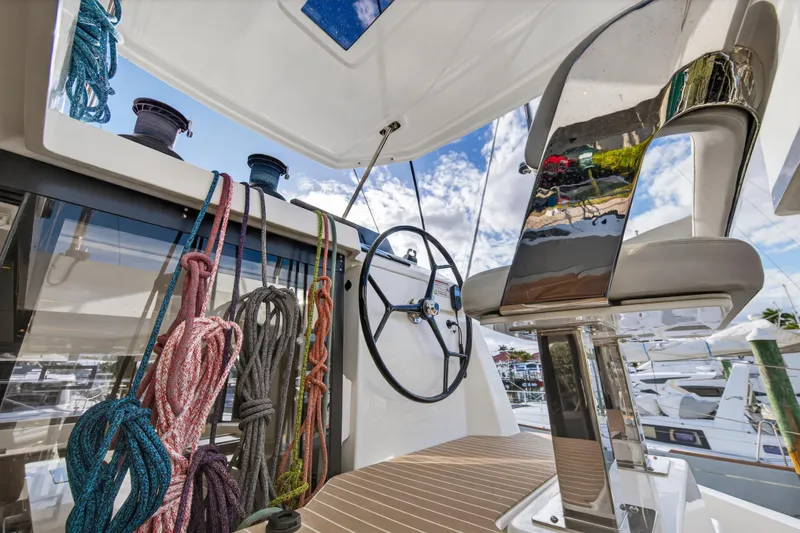 Slide: The Image of Helm of 2025 Leopard 46 yacht with ropes and steering wheel. - 70