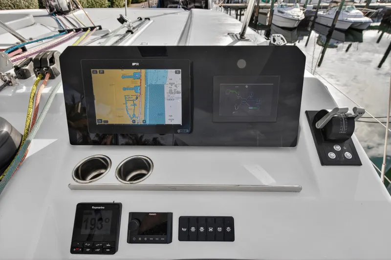 Slide: The Image of Control panel of a 2025 Leopard 46 yacht with navigation screens and controls. - 73