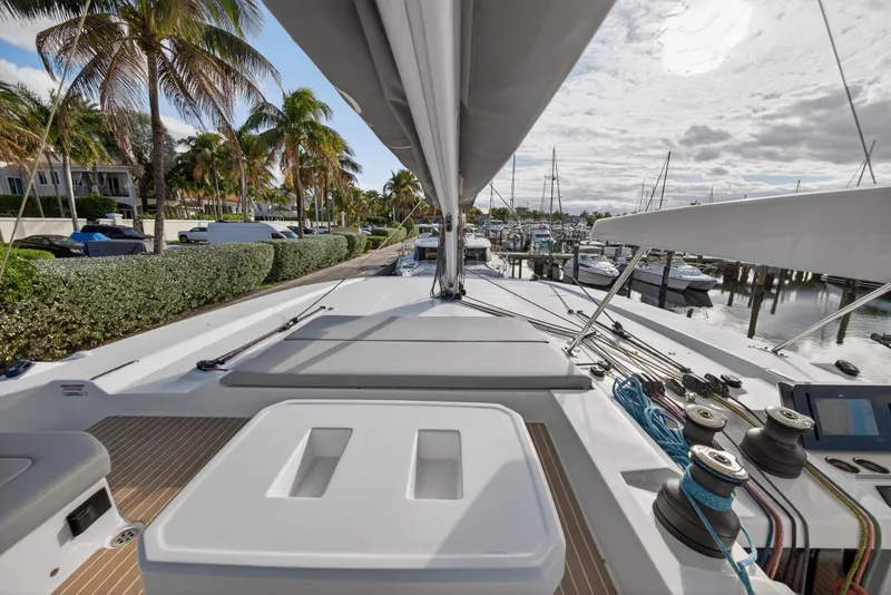 Slide: The Image of Deck view of 2025 Leopard 46 yacht docked near palm trees and marina. - 79