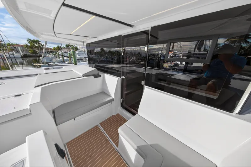 Slide: The Image of Modern Leopard 46 yacht interior, featuring sleek seating and glass doors, 2025 model. - 84