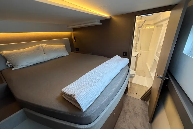 Slide: The Image of Luxurious 2025 Leopard 46 yacht interior with modern seating and dining area. - 9