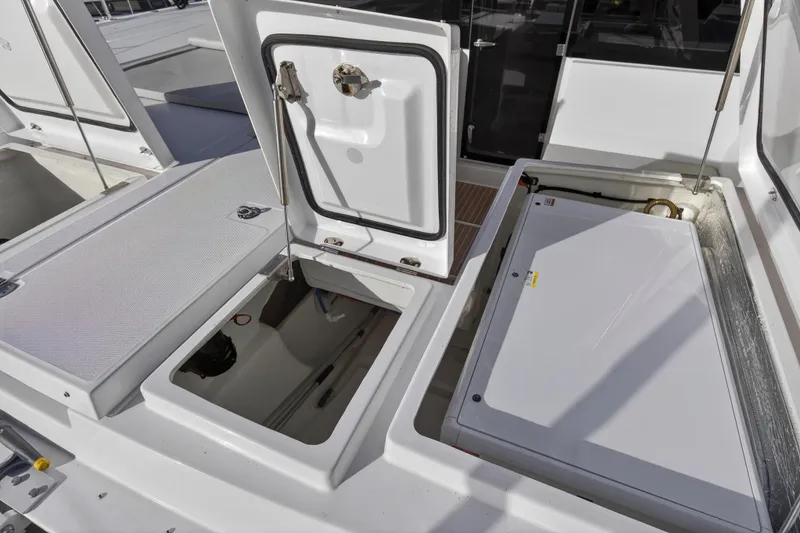Slide: The Image of Open compartments on a 2025 Leopard 46 yacht, showcasing storage and mechanical access. - 91