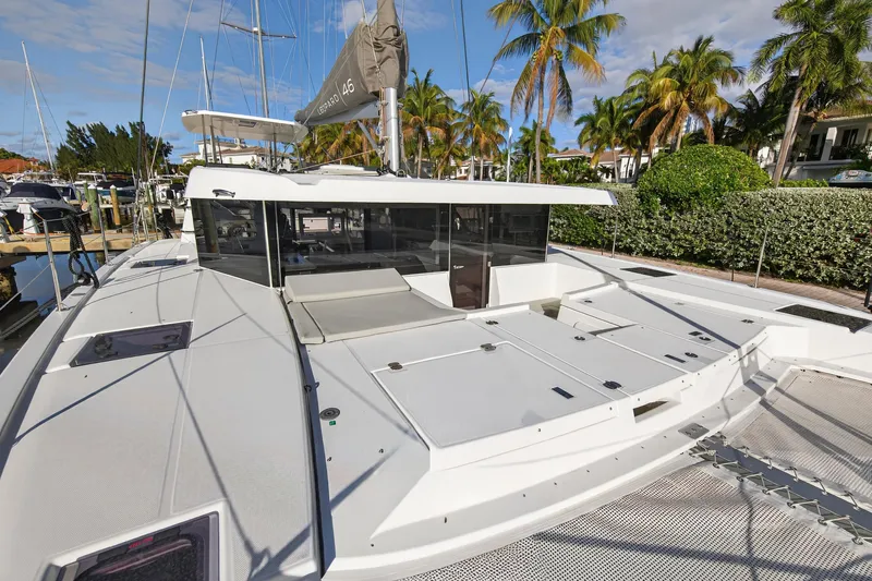 Slide: The Image of 2025 Leopard 46 catamaran docked, featuring spacious deck and modern design. - 93