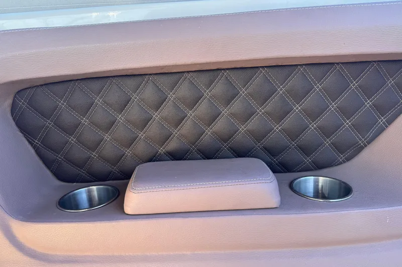 Slide: The Image of 2010 Cobalt 323 interior with quilted panel and dual cup holders. - 17